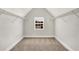 A small closet area with metal shelves and a window with a view of the neighboring house at 1111 Forest Bend Dr., Calabash, NC 28467