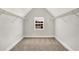 Walk-in closet with neutral carpet, wire shelving, and window offering natural light and neighborhood views at 1111 Forest Bend Dr., Calabash, NC 28467