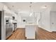 Kitchen featuring an island, stainless steel appliances, and white cabinetry at 1111 Forest Bend Dr., Calabash, NC 28467