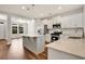 Modern kitchen with stainless appliances, a center island, and white cabinets at 1111 Forest Bend Dr., Calabash, NC 28467