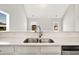 Close up of a modern kitchen sink with a stainless steel faucet and a view out the window at 1111 Forest Bend Dr., Calabash, NC 28467