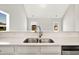 Close-up of a modern kitchen sink with stainless steel fixtures and quartz countertops at 1111 Forest Bend Dr., Calabash, NC 28467