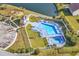 Aerial view showcasing the community pool, hot tub, playground, and pond at 1166 Bethpage Dr., Myrtle Beach, SC 29579