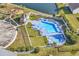 Aerial view of a community pool and hot tub with lounge chairs, offering a resort-style living experience at 1166 Bethpage Dr., Myrtle Beach, SC 29579