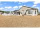 Wide view of backyard and patio, sunroom, and well-maintained lawn at 1166 Bethpage Dr., Myrtle Beach, SC 29579