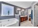 Bathroom featuring soaking tub, vanity with tile floors, and garden view window at 1166 Bethpage Dr., Myrtle Beach, SC 29579