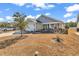 Charming single-Gathering home with a well-manicured lawn and a cozy front porch at 1166 Bethpage Dr., Myrtle Beach, SC 29579