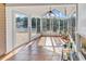 Sunroom with sliding doors and windows overlooking a serene lake at 1166 Bethpage Dr., Myrtle Beach, SC 29579