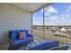 Inviting screened balcony featuring comfortable seating and beautiful community views at 117 Ella Kinley Circle # 302, Myrtle Beach, SC 29588