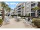 Outdoor seating area with tables, chairs, and barbecue grills for community gatherings at 117 Ella Kinley Circle # 302, Myrtle Beach, SC 29588