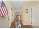 Inviting hallway featuring hardwood floors and nautical-themed décor at 117 Ella Kinley Circle # 302, Myrtle Beach, SC 29588