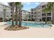 Beautiful community pool surrounded by palm trees and updated condo buildings at 117 Ella Kinley Circle # 302, Myrtle Beach, SC 29588