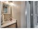 Bathroom featuring a marble countertop, a decorative shower curtain, and vanity lighting at 1205 Formby Ct., Myrtle Beach, SC 29588