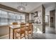 Cozy dining area adjacent to a modern kitchen, bathed in natural light from a large window at 1205 Formby Ct., Myrtle Beach, SC 29588