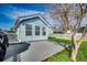 Back exterior showcasing well-maintained lawn, concrete patio, and white fence at 1205 Formby Ct., Myrtle Beach, SC 29588