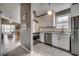 Well-lit kitchen with stainless steel appliances, modern white cabinets, and marble countertops at 1205 Formby Ct., Myrtle Beach, SC 29588