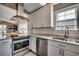 Modern kitchen featuring stainless steel appliances, white cabinets, and ample counter space for meal preparation at 1205 Formby Ct., Myrtle Beach, SC 29588