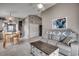 Open floor plan shows living room with vaulted ceiling, gray sofa, and breakfast nook at 1205 Formby Ct., Myrtle Beach, SC 29588