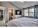 Spacious main bedroom showcasing a large bed, dresser, and ensuite bathroom at 1205 Formby Ct., Myrtle Beach, SC 29588