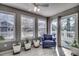 Bright sunroom with a chair and multiple windows overlooking the backyard at 1205 Formby Ct., Myrtle Beach, SC 29588