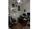 Office with a wooden desk, a chair, and walls decorated with pictures at 127 Nu-Shell St, Georgetown, SC 29440