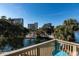 A peaceful pond view from a private condo balcony with seating to take in the scenery at 129 Hartland Dr. # 8-I, Myrtle Beach, SC 29572