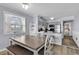 Dining area adjacent to the kitchen with a large window and natural light at 1310 N Waccamaw Dr. # 208, Garden City Beach, SC 29576