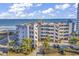 Beautiful oceanfront condo building with lush landscaping and ample parking spaces at 1310 N Waccamaw Dr. # 208, Garden City Beach, SC 29576