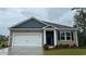 Charming single-story home featuring a two-car garage and inviting front lawn at 140 Leyland Cypress Dr, Conway, SC 29527