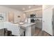 Kitchen island with granite countertops, bar seating, and stainless steel appliances at 141 Leyland Cypress Dr, Conway, SC 29527