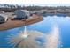 Aerial of home's backyard overlooking large water feature with fountain, adjacent to private fenced in backyard and patio at 1504 Oyster Bay Ct., Myrtle Beach, SC 29588