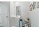 Well-lit bathroom with a vanity, mirror, and storage, providing both functionality and style at 1504 Oyster Bay Ct., Myrtle Beach, SC 29588