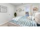 Cozy bedroom with a blue and white patterned bedspread, nautical-themed decor, and bright natural light at 1504 Oyster Bay Ct., Myrtle Beach, SC 29588