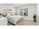 Inviting bedroom featuring a comfy bed, a bright window, and a minimalist modern design at 1504 Oyster Bay Ct., Myrtle Beach, SC 29588