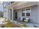 Cozy front porch with comfortable seating, offering a welcoming entrance to the home at 1504 Oyster Bay Ct., Myrtle Beach, SC 29588