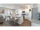 Open concept kitchen with white cabinets, granite countertops, and seating at the kitchen island at 1504 Oyster Bay Ct., Myrtle Beach, SC 29588