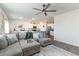 Spacious living room with a sectional sofa that flows seamlessly into the kitchen and dining area at 1504 Oyster Bay Ct., Myrtle Beach, SC 29588