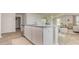 Kitchen island featuring barstool seating and stainless-steel dishwasher and views of the living room at 153 Leyland Cypress Dr, Conway, SC 29527
