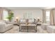 Cozy living room with comfortable seating, neutral tones, and lots of natural light at 153 Leyland Cypress Dr, Conway, SC 29527