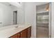 Bathroom view shows the vanity with a large mirror and access to the bedroom at 156 Parmelee Dr. # B, Murrells Inlet, SC 29576