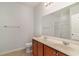 Bathroom featuring double sinks with a wood vanity and a large mirror at 156 Parmelee Dr. # B, Murrells Inlet, SC 29576