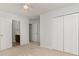 Carpeted bedroom with double closet, ceiling fan, and views of the bathroom at 156 Parmelee Dr. # B, Murrells Inlet, SC 29576