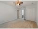 Neutral bedroom featuring a ceiling fan, carpeted floors and double door closet at 156 Parmelee Dr. # B, Murrells Inlet, SC 29576