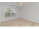 Bright, neutral bedroom with a large window, creating a peaceful and inviting atmosphere at 156 Parmelee Dr. # B, Murrells Inlet, SC 29576