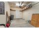 Functional garage space with storage shelves and a door, ideal for parking and organization at 156 Parmelee Dr. # B, Murrells Inlet, SC 29576
