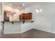 Open-concept kitchen featuring wood cabinets, granite countertops, and stainless steel appliances at 156 Parmelee Dr. # B, Murrells Inlet, SC 29576