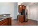 Kitchen with stainless steel refrigerator, wood cabinets, and granite countertops at 156 Parmelee Dr. # B, Murrells Inlet, SC 29576