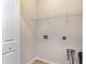 Bright laundry room with white wire shelving and hookups ready for your washer and dryer at 156 Parmelee Dr. # B, Murrells Inlet, SC 29576