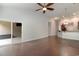 Open living room with hardwood floors, sliding glass doors, and a view into the kitchen at 156 Parmelee Dr. # B, Murrells Inlet, SC 29576