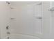 Shower featuring a clean white design with built-in shelving and modern fixtures at 156 Parmelee Dr. # B, Murrells Inlet, SC 29576
